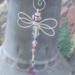 Lightweight wire dragonfly ornament designed for hanging indoor or garden decor